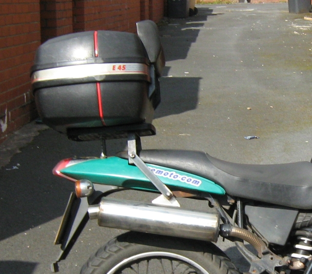 the rear end of my 125 with the top box and diy exhaust pipe